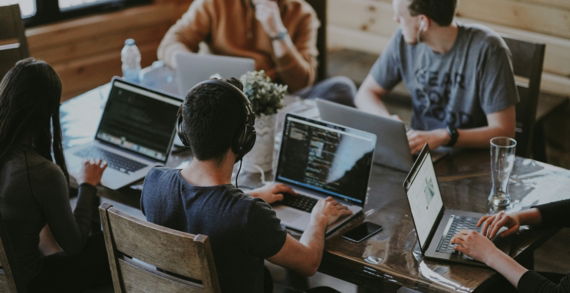 group of people using laptop computer