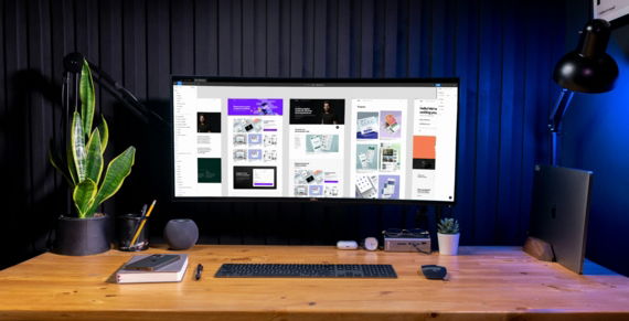 silver imac on brown wooden table